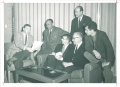 (Left to right) Paul Engle, Ralph Ellison, Mark Harris, Dwight MacDonald, Norman Mailer, and (standing) Arnold Gingrich. (December 4, 1959, Iowa State)